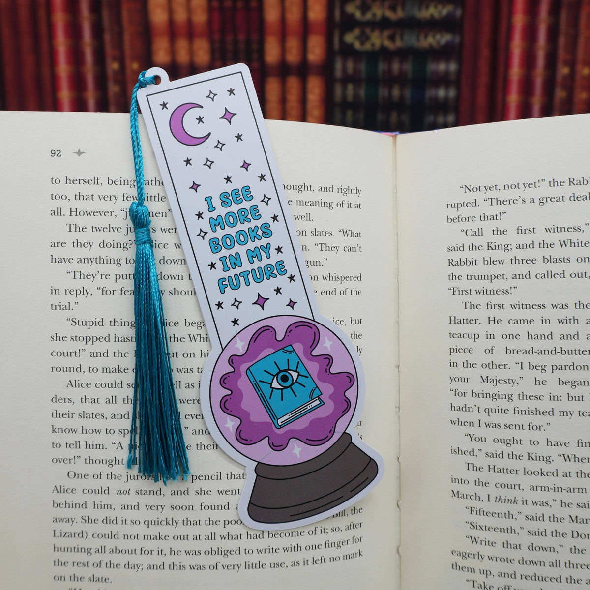 Bookmark with a crystal ball design on an open book