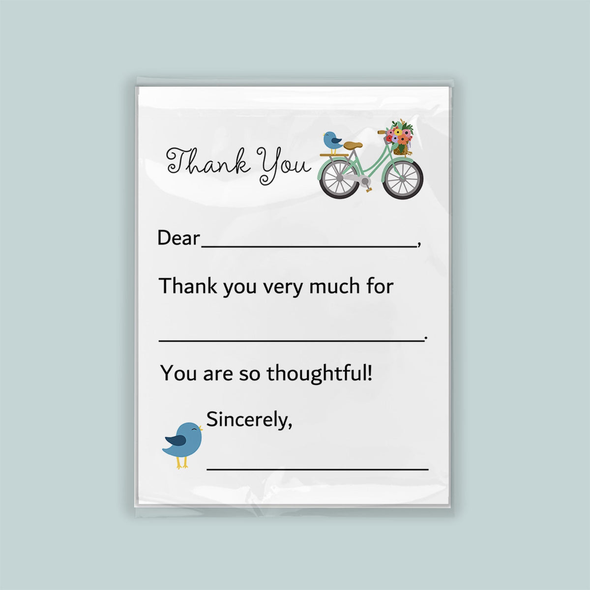 The image is a white card with a bicycle and a bird on it. The card has a message written on it, expressing gratitude.