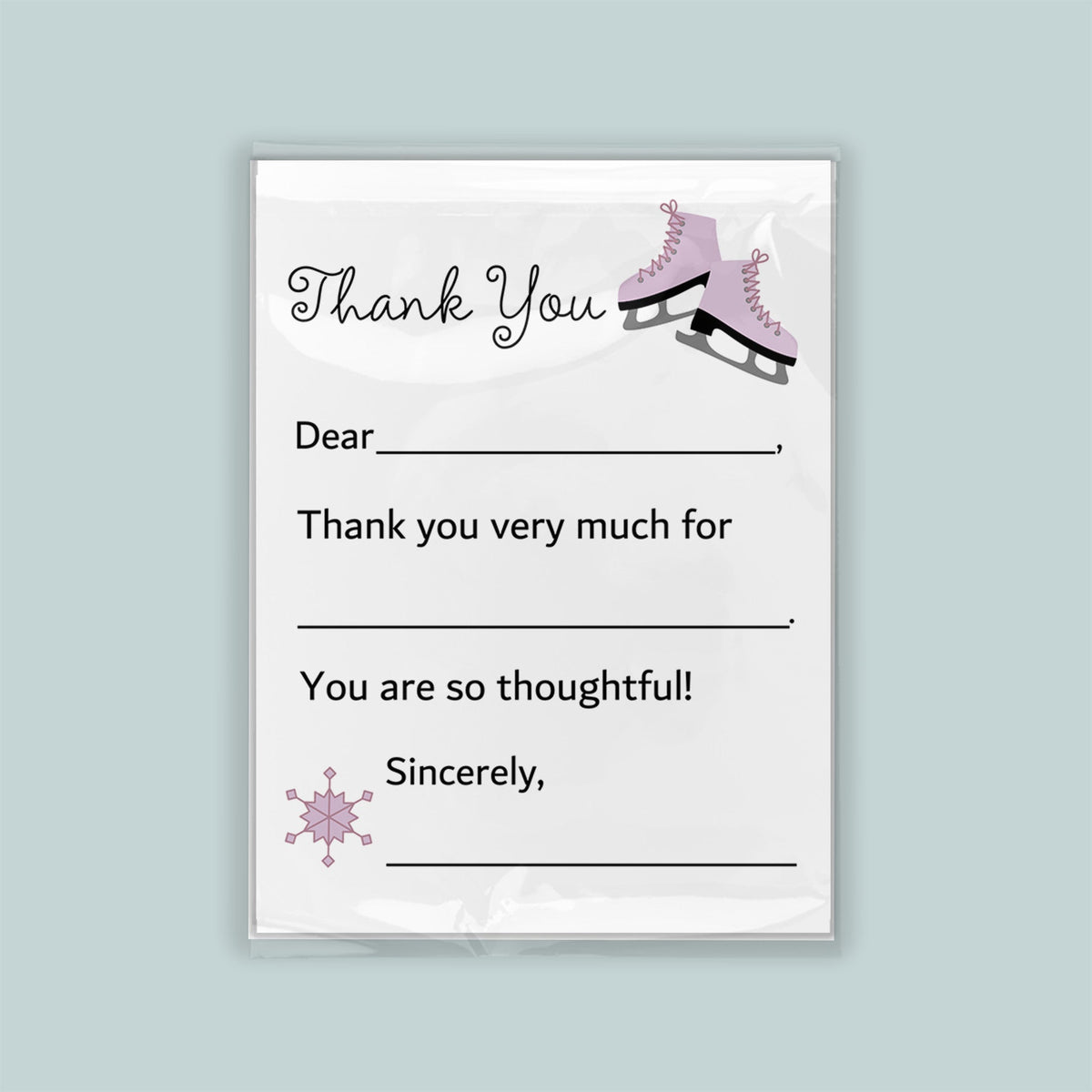 The image is a white thank you card with a pair of pink skates on the top right corner. The card has a blank space for a message and a snowflake graphic on the bottom right corner.