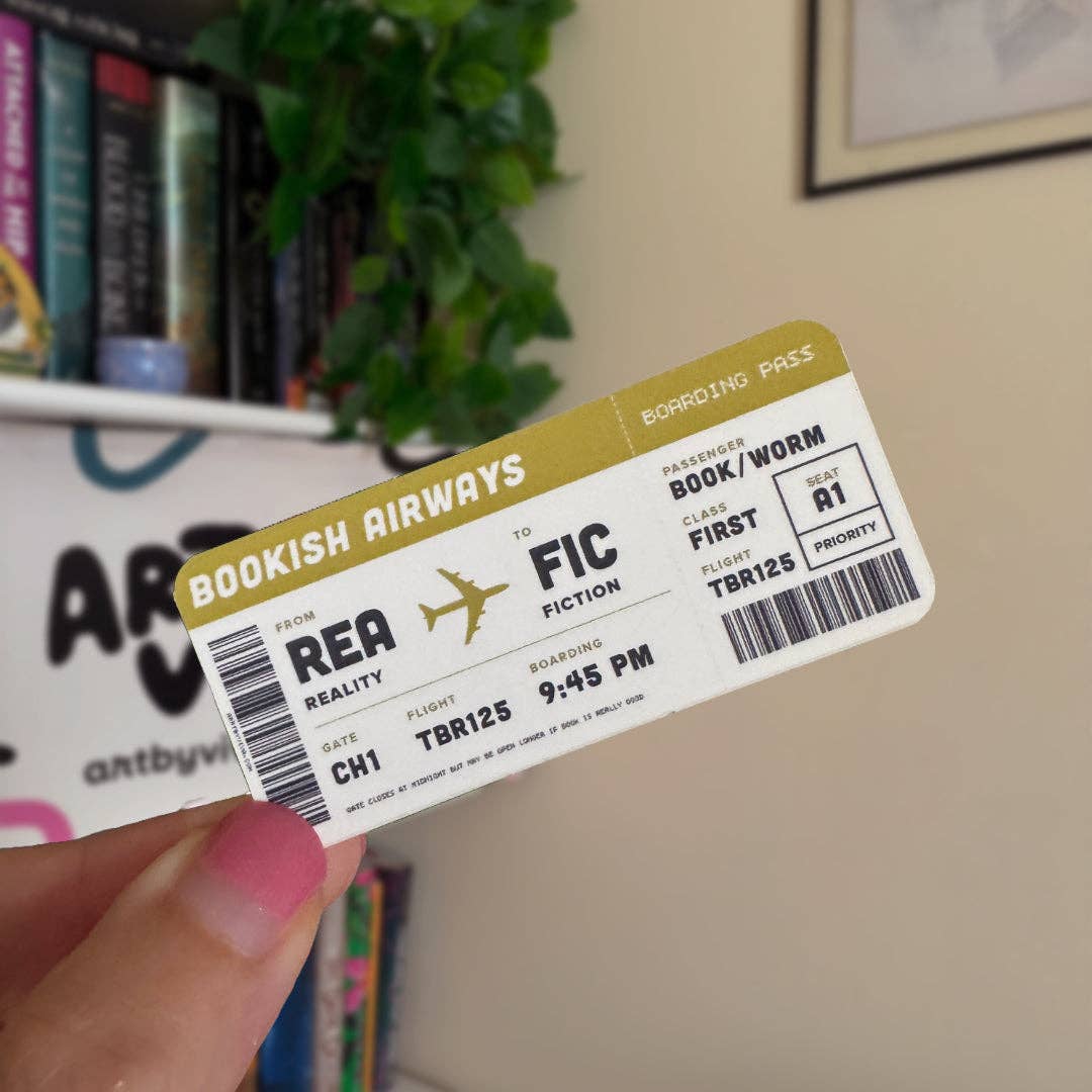 Book-themed boarding pass held by a hand with books and a plant in the background
