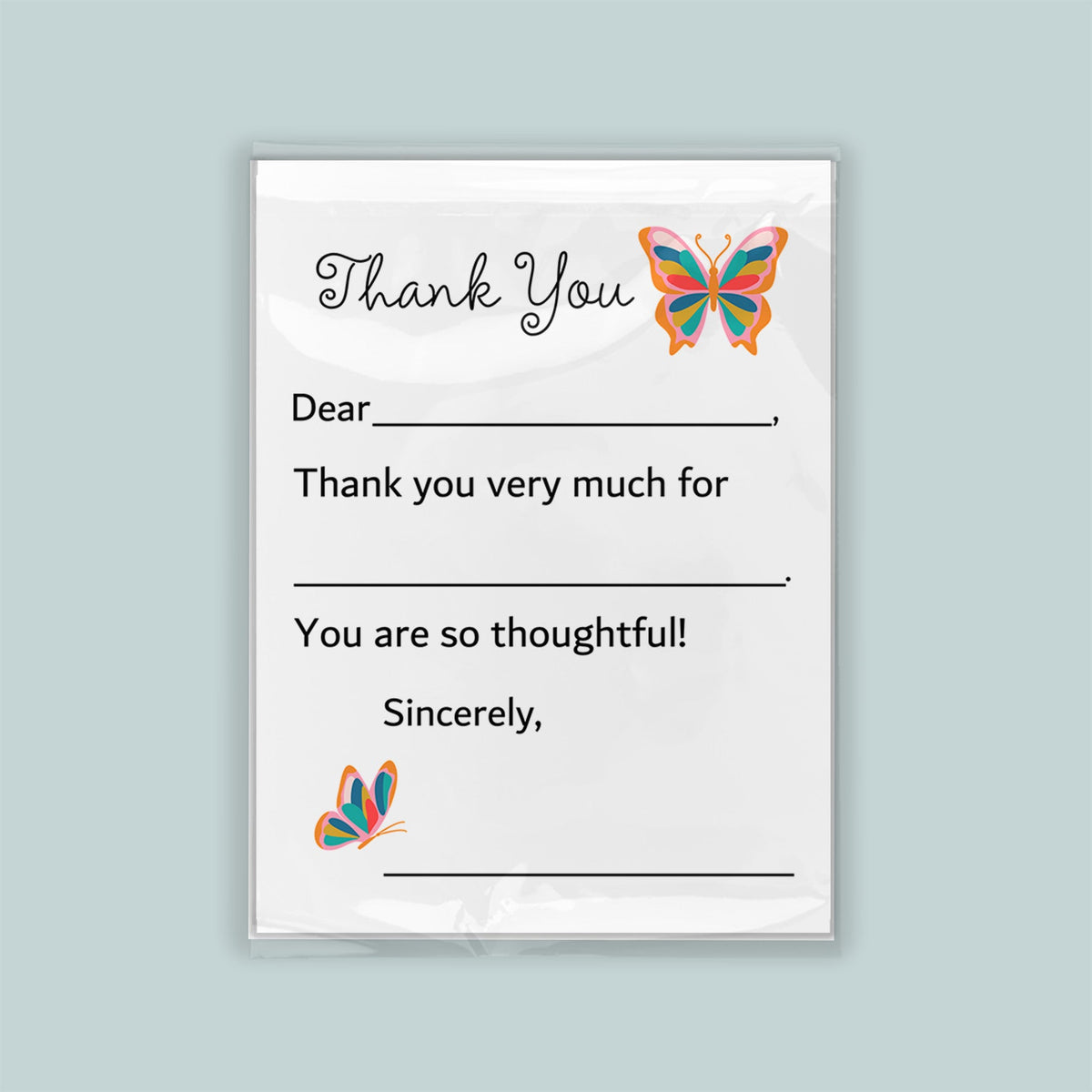 a white card with a message and two butterflies. The message is a "Thank You" card, expressing gratitude for something. The butterflies are decorative and add a touch of whimsy to the card. The card is not too long, as it contains only a few lines of text. The message is simple and direct, focusing on the recipient rather than providing unnecessary details.