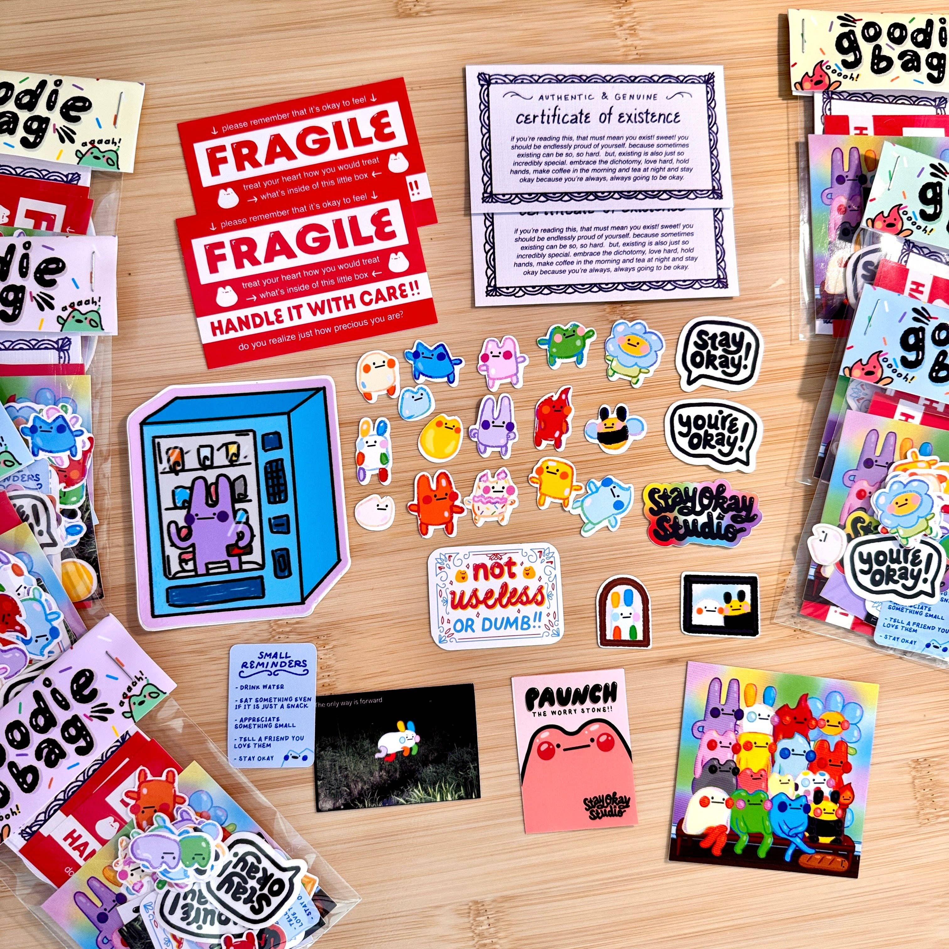 Collection of colorful stickers and cards on a wooden surface