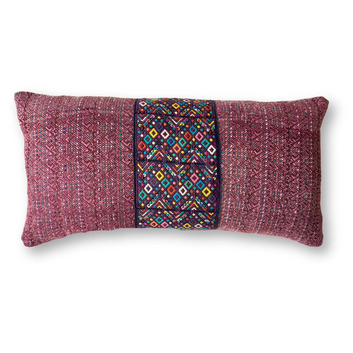 Decorative pillow with a multicolored geometric pattern on a white background