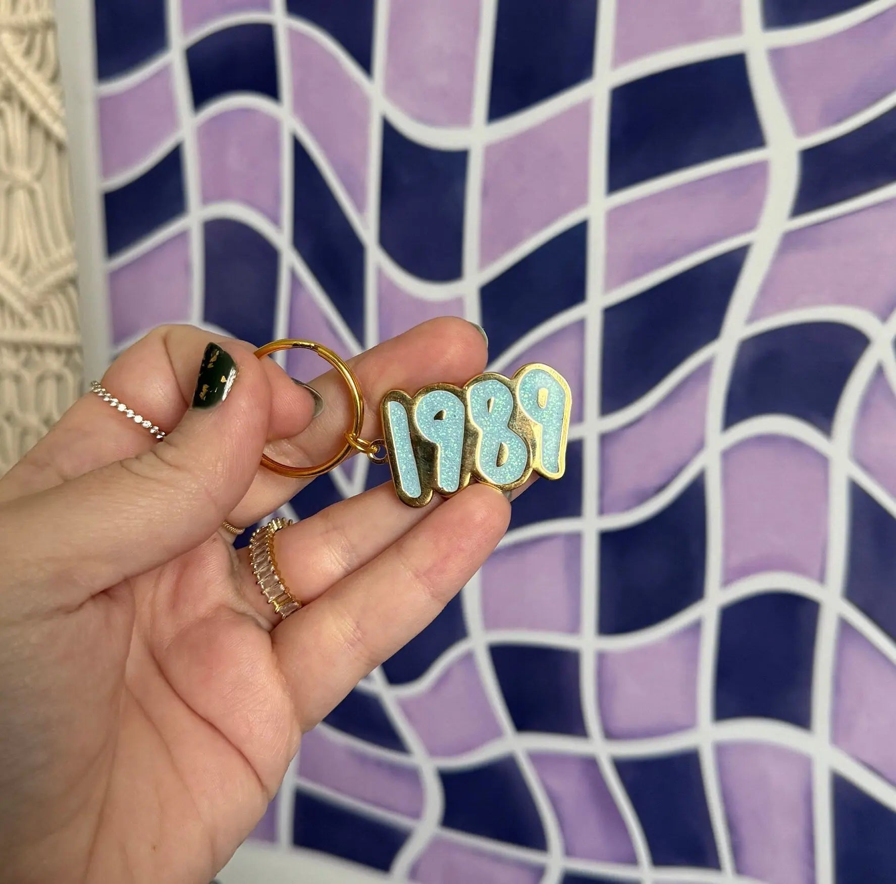 1989 blue glitter enamel keychain back detail — reverse side of the gold toned metal keyring by indie artist MangoIllustrated