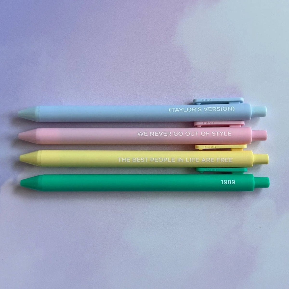 1989 Pen Set detail — powder blue and blush pink jotter pens with embossed lettering by indie artist MangoIllustrated