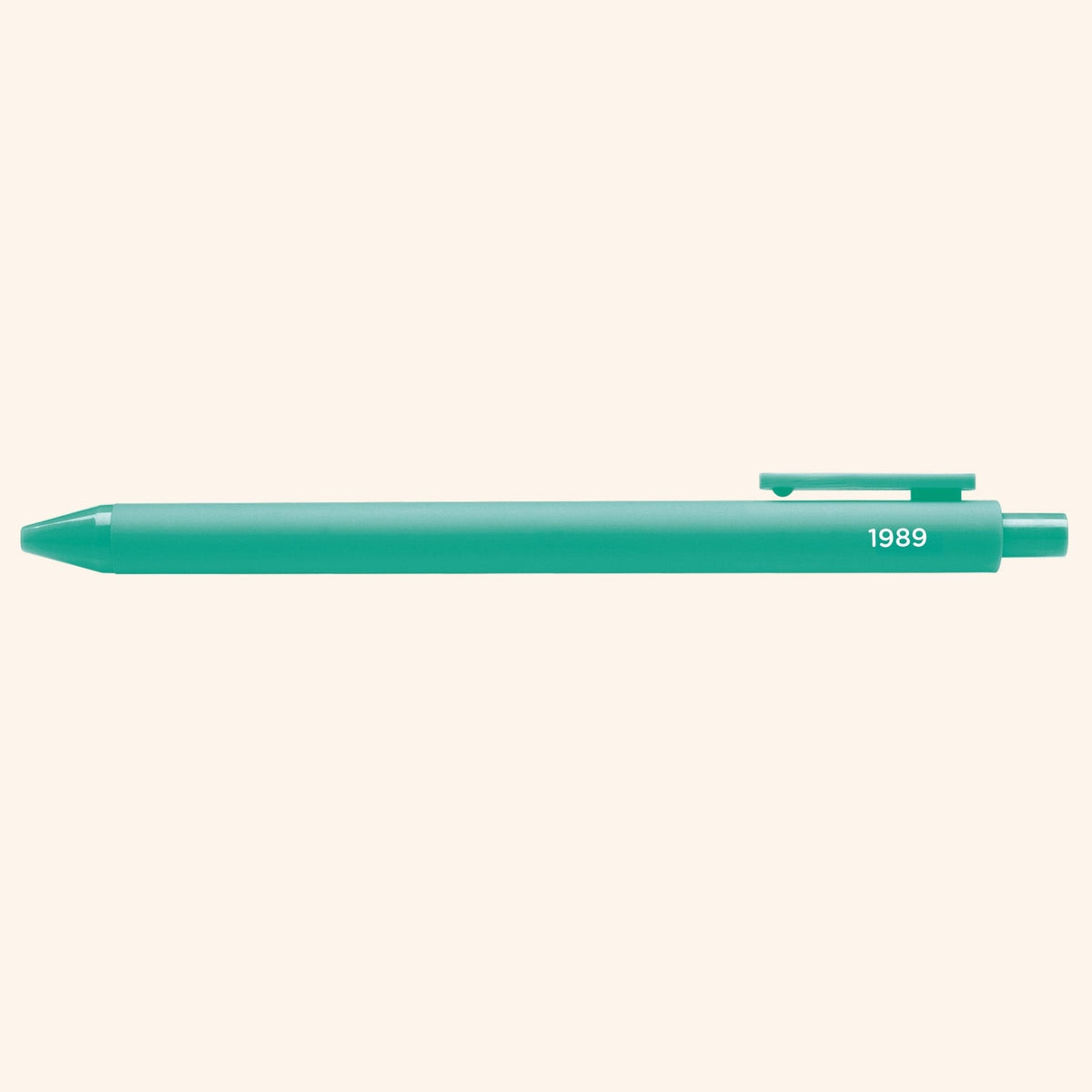1989 jotter pen styled on a desk — teal barrel gel pen by indie artist MangoIllustrated