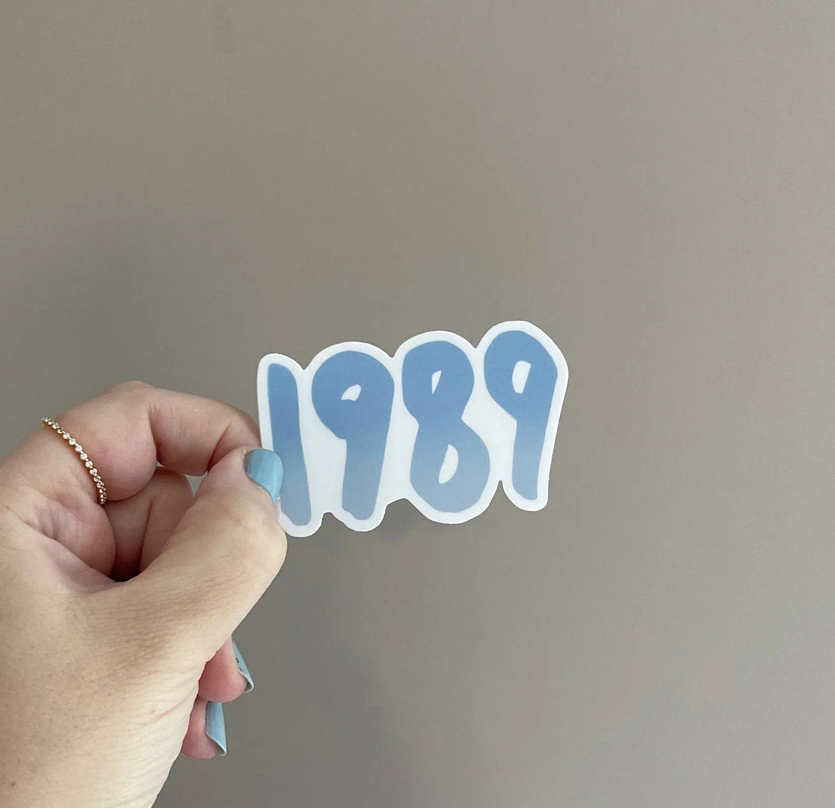 1989 sticker - blue — the full hand lettered 1989 design shown on white by indie artist MangoIllustrated