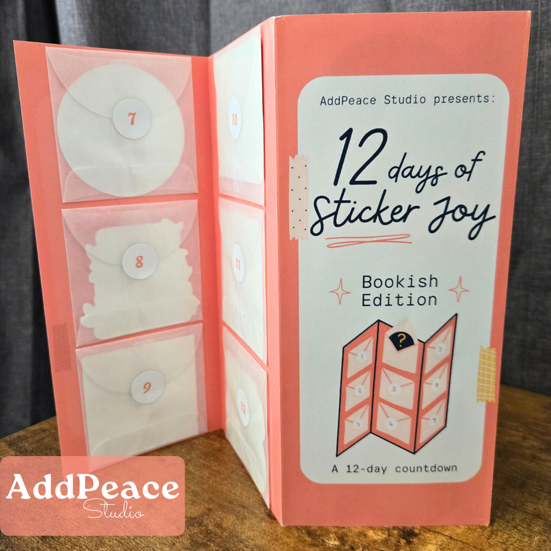12 days of Sticker Joy Bookish Edition calendar by AddPeace Studio on a wooden surface.