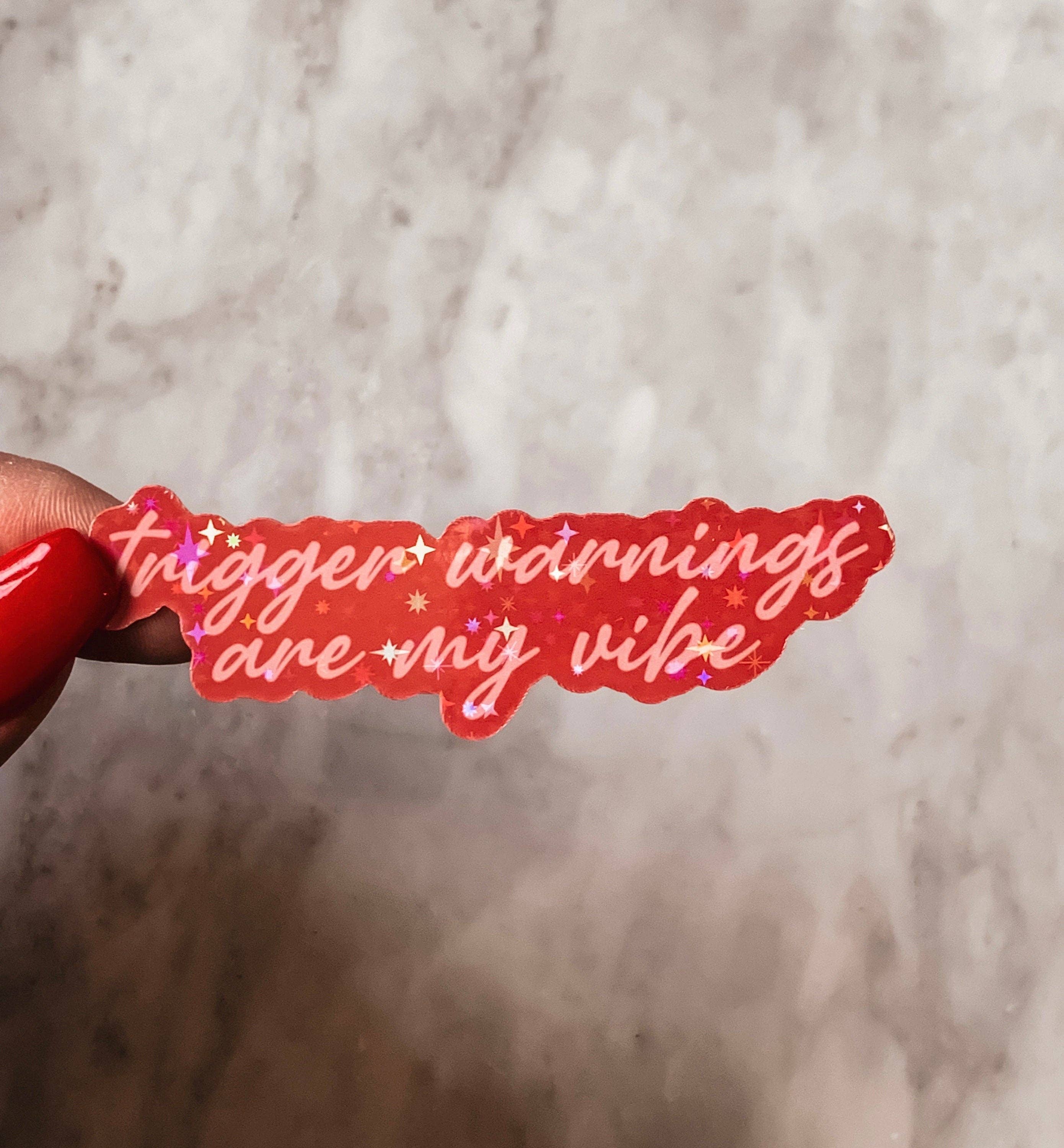 Red sticker with text &