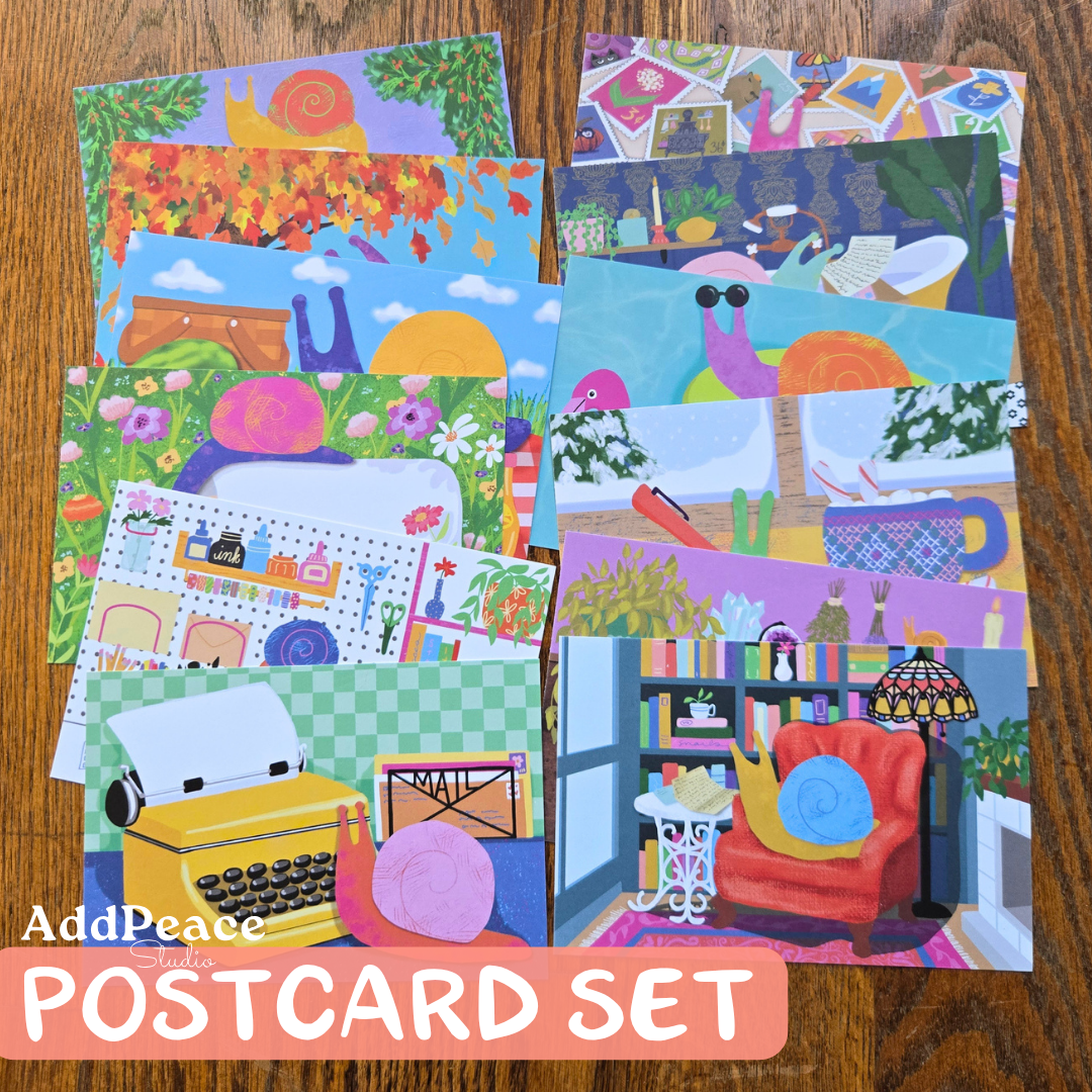 Set of colorful postcards with various illustrations on a wooden surface, featuring the brand &