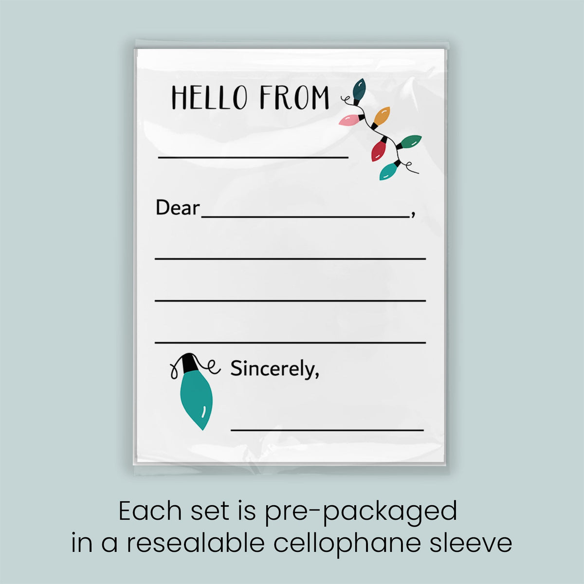 The image is a greeting card with a blank space for a message and a decorative element of a string of colorful lights. Each set is pre-packaged in a resealable cellophane sleeve.
