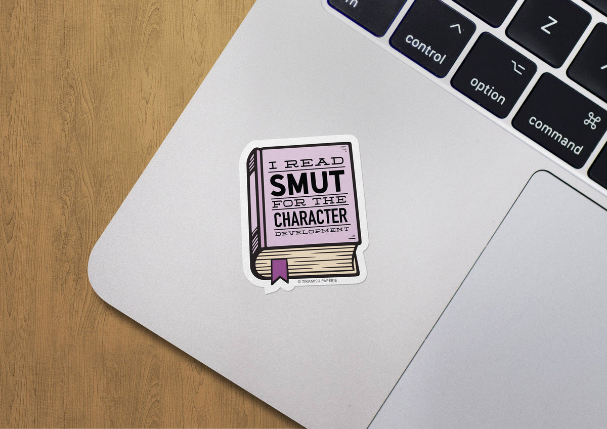 Laptop with a sticker reading &