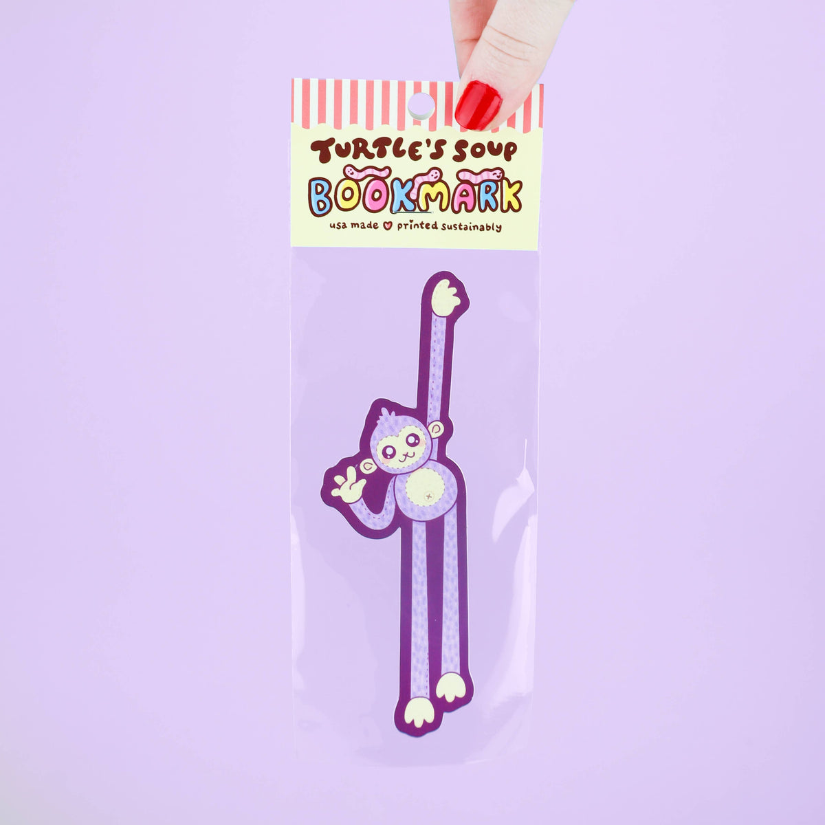 Purple cartoon bookmark in packaging with &