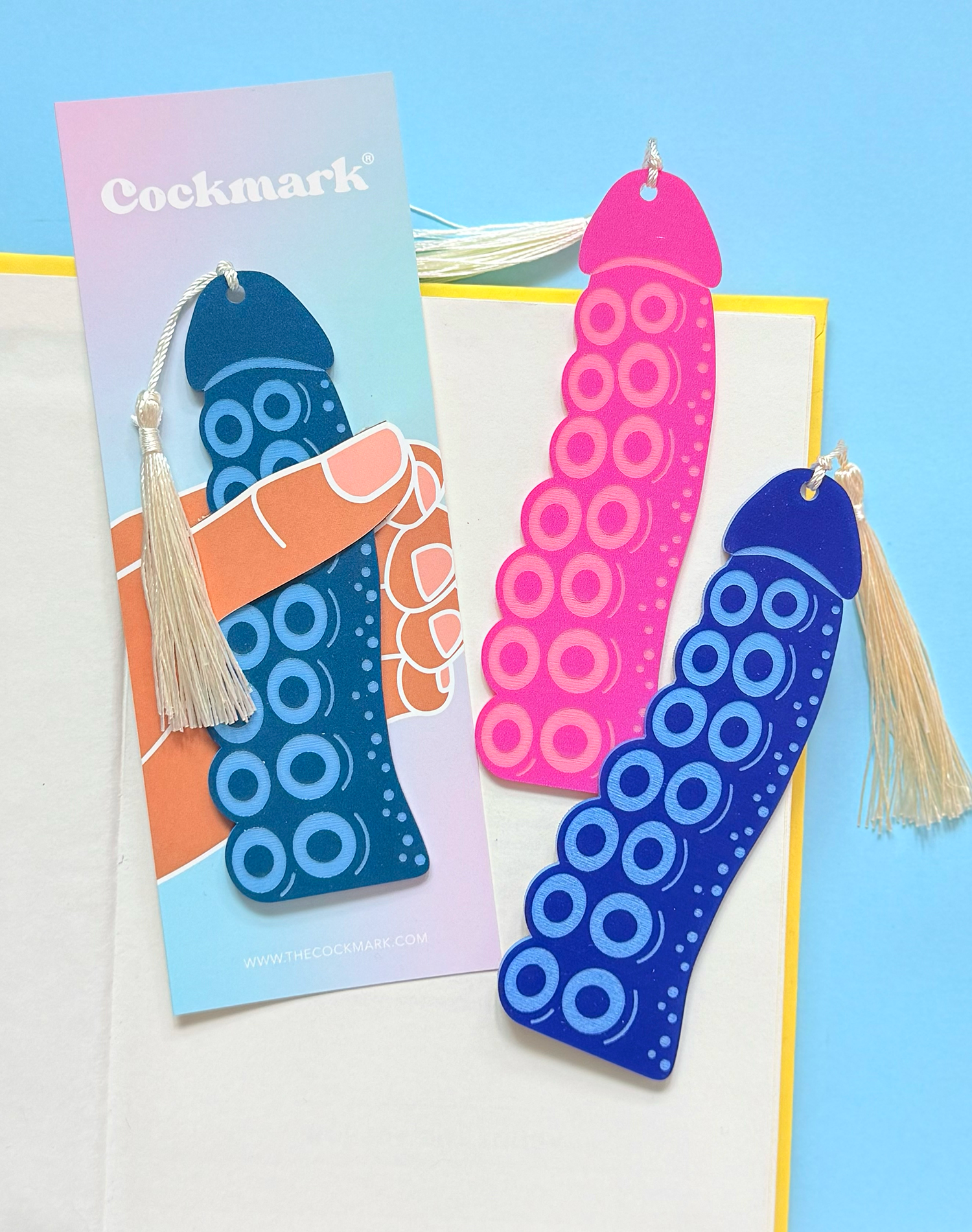 Colorful bookmarks with tassels on a blue background