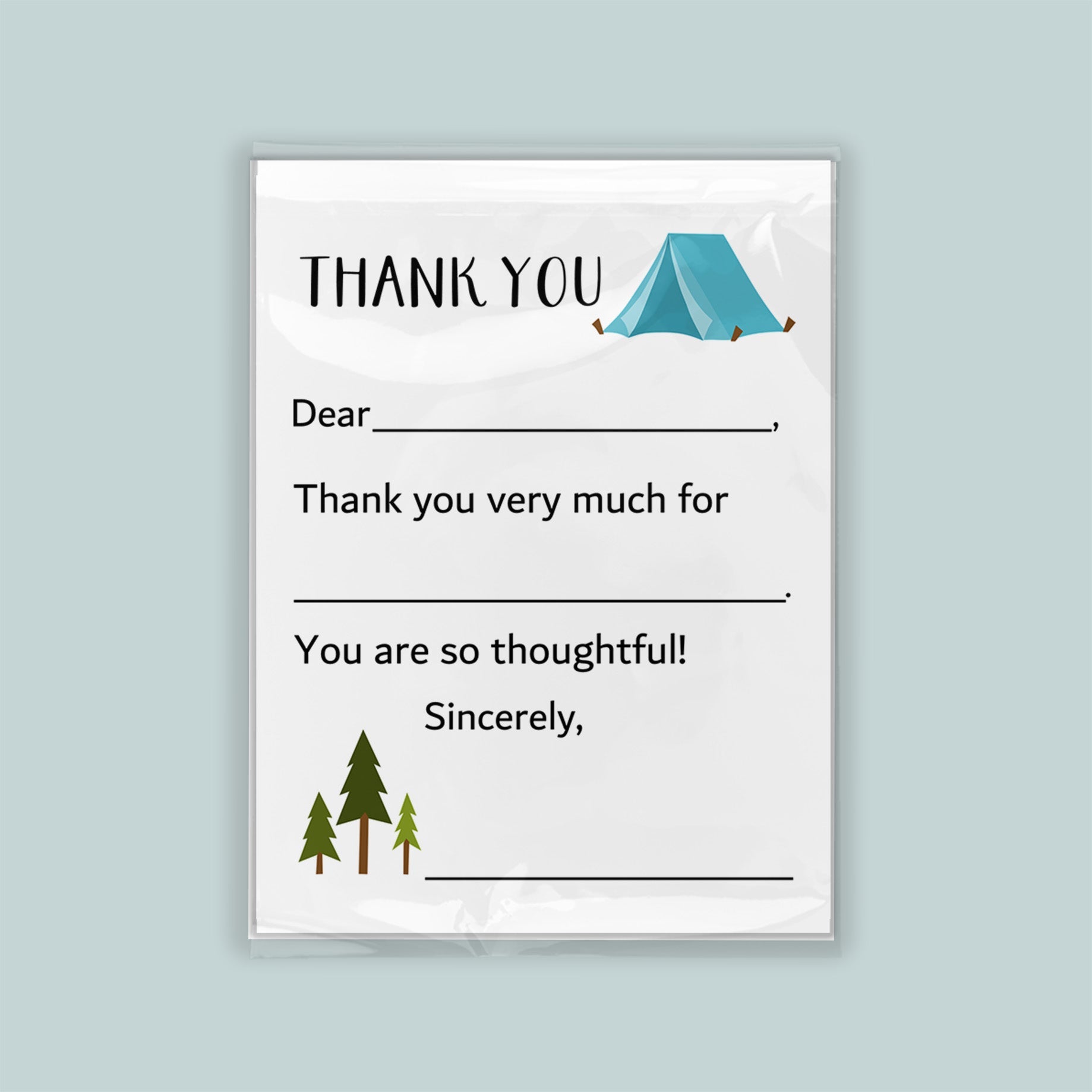 The image is a white card with a blue tent and pine trees on it. The card has a message that says "Thank you very much for" and "You are so thoughtful!" The card is set against a light blue background.
