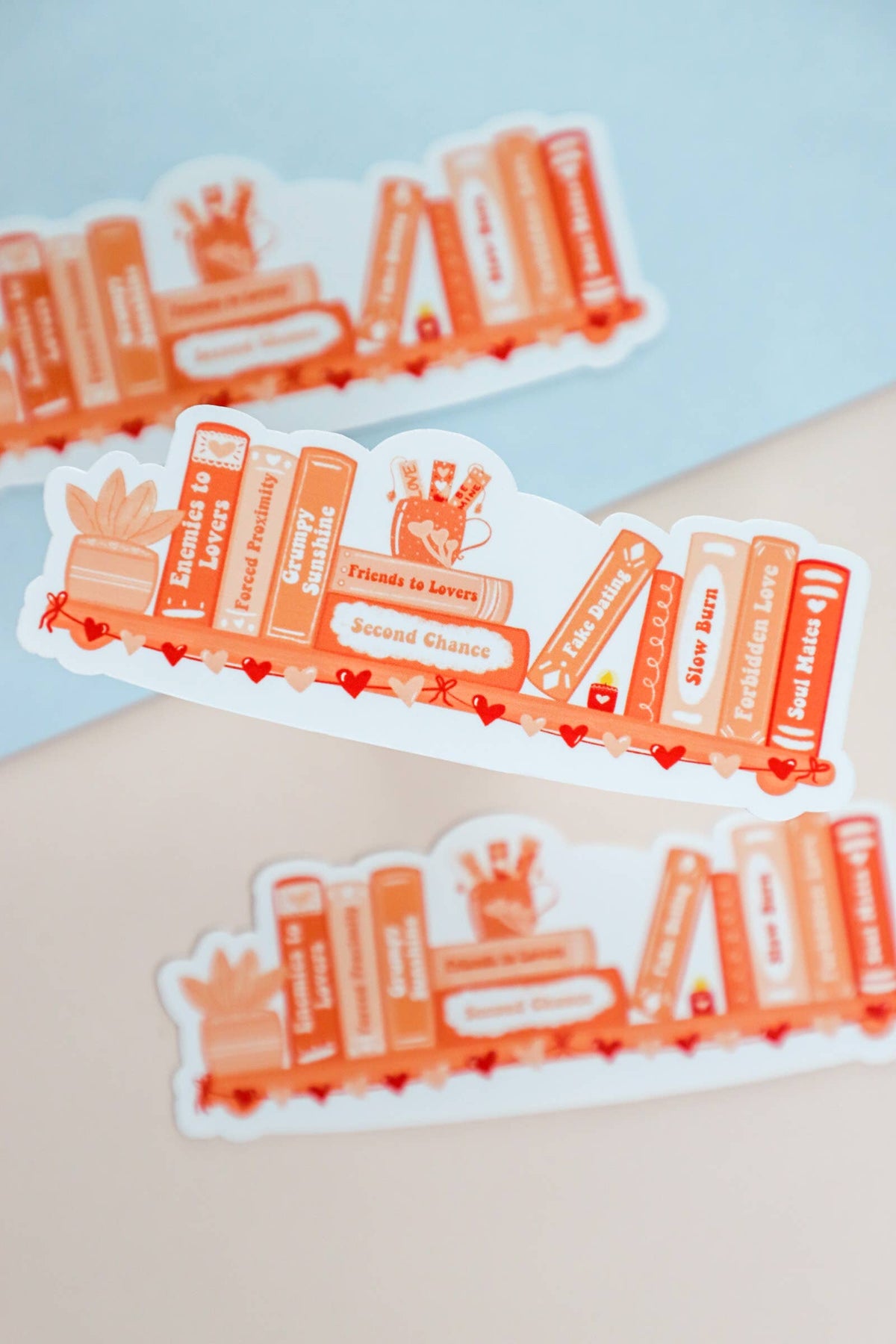 Set of orange and white stickers with text on a light blue background