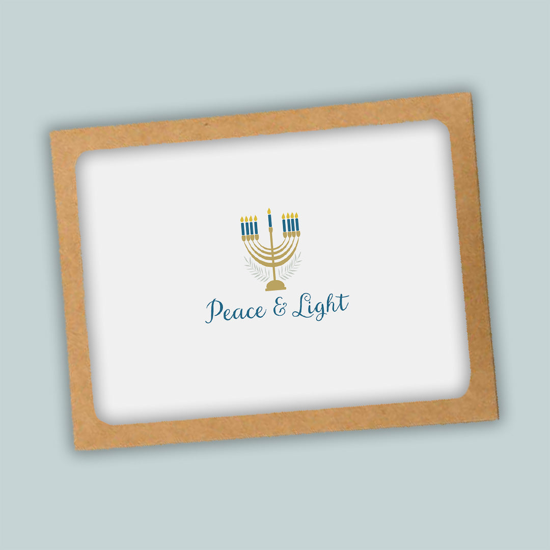A greeting card with a peace and light theme, featuring a stylized menorah with candles and the text "Peace & Light" on a white background.