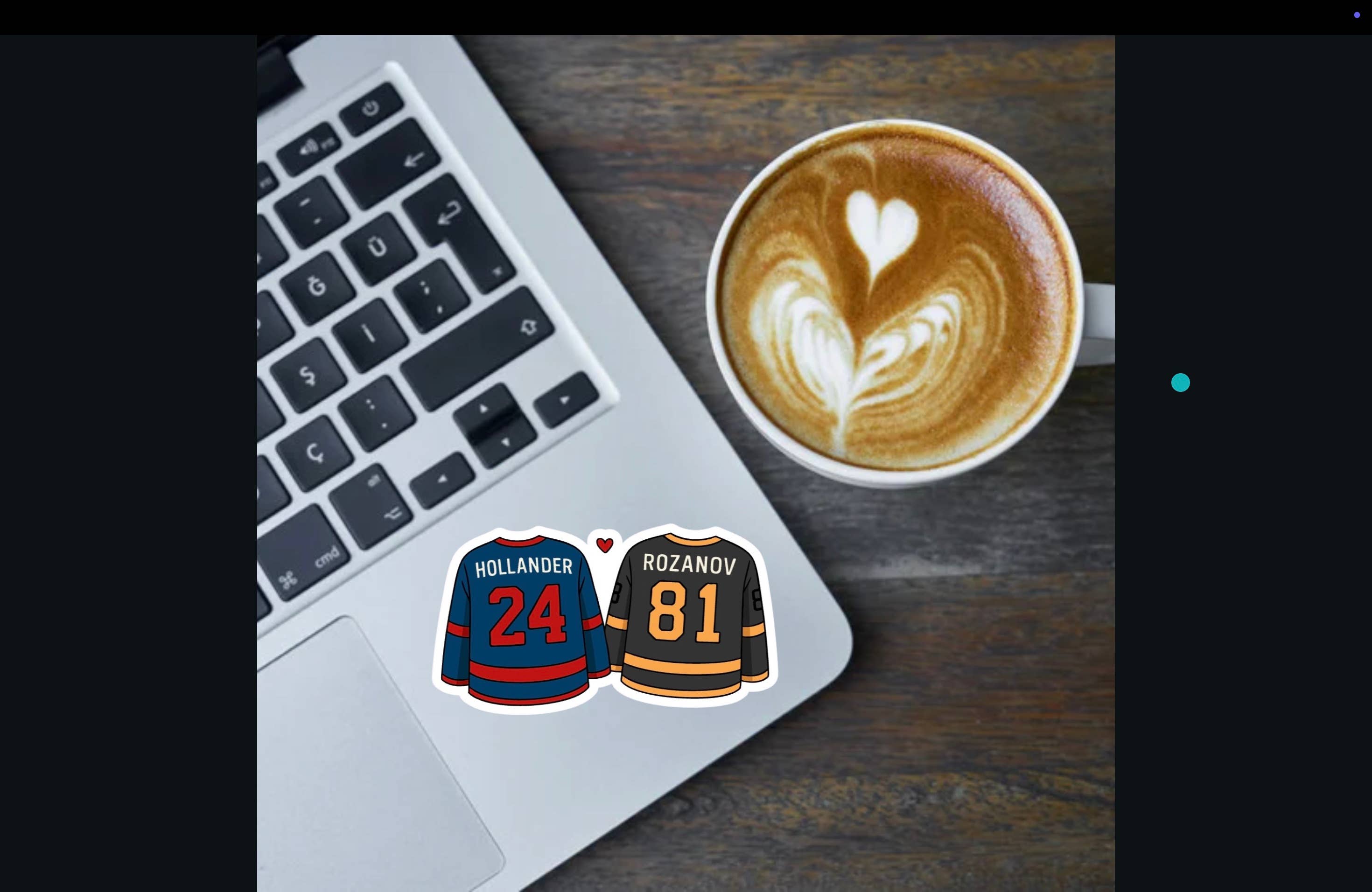 Laptop with hockey jerseys on stickers next to a cup of coffee with latte art.