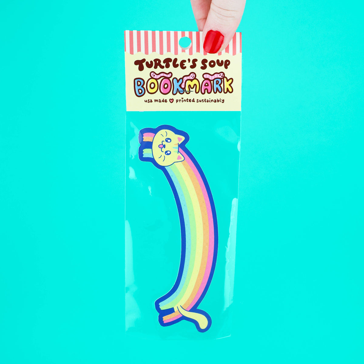 Colorful rainbow cat bookmark in packaging with &