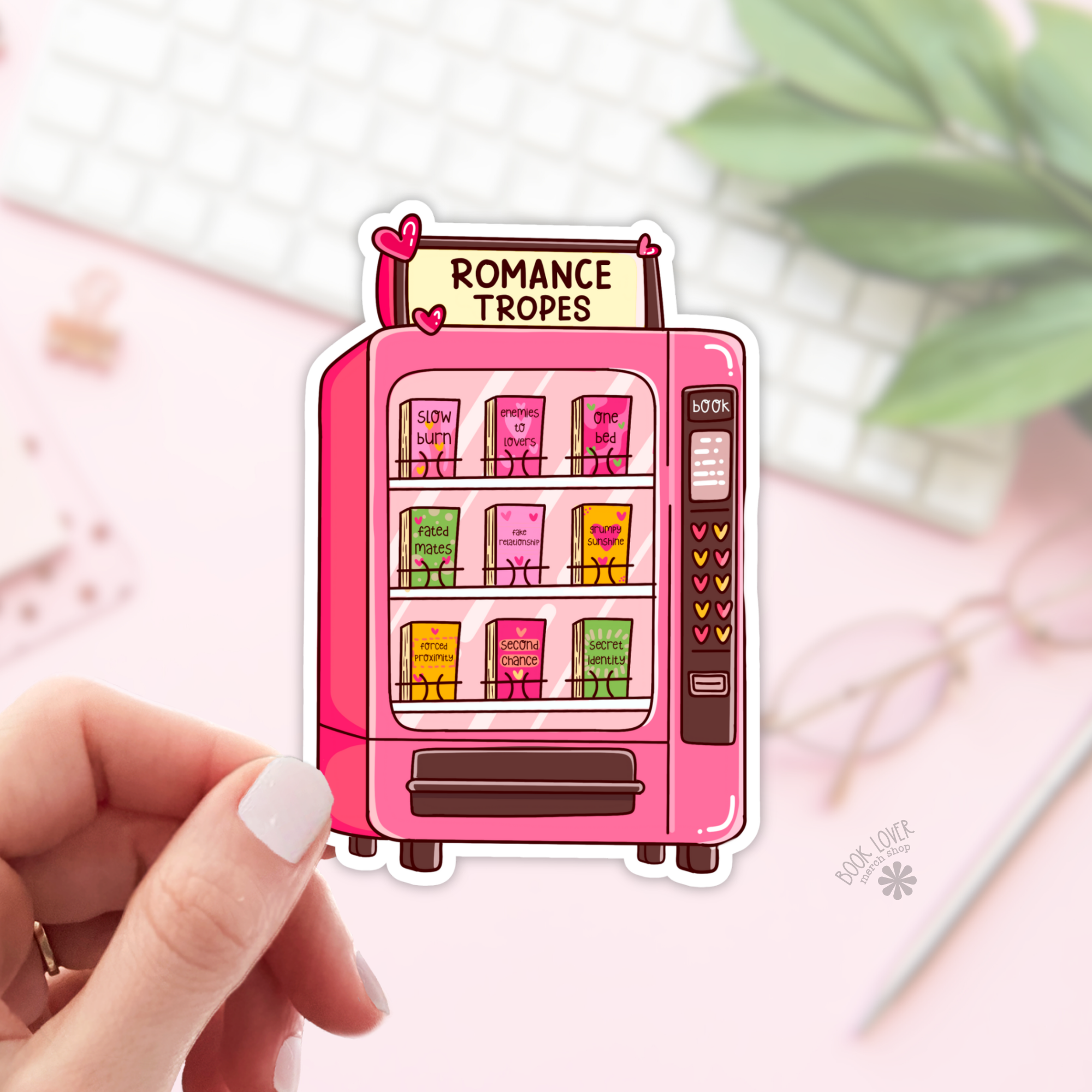 Pink vending machine sticker labeled &
