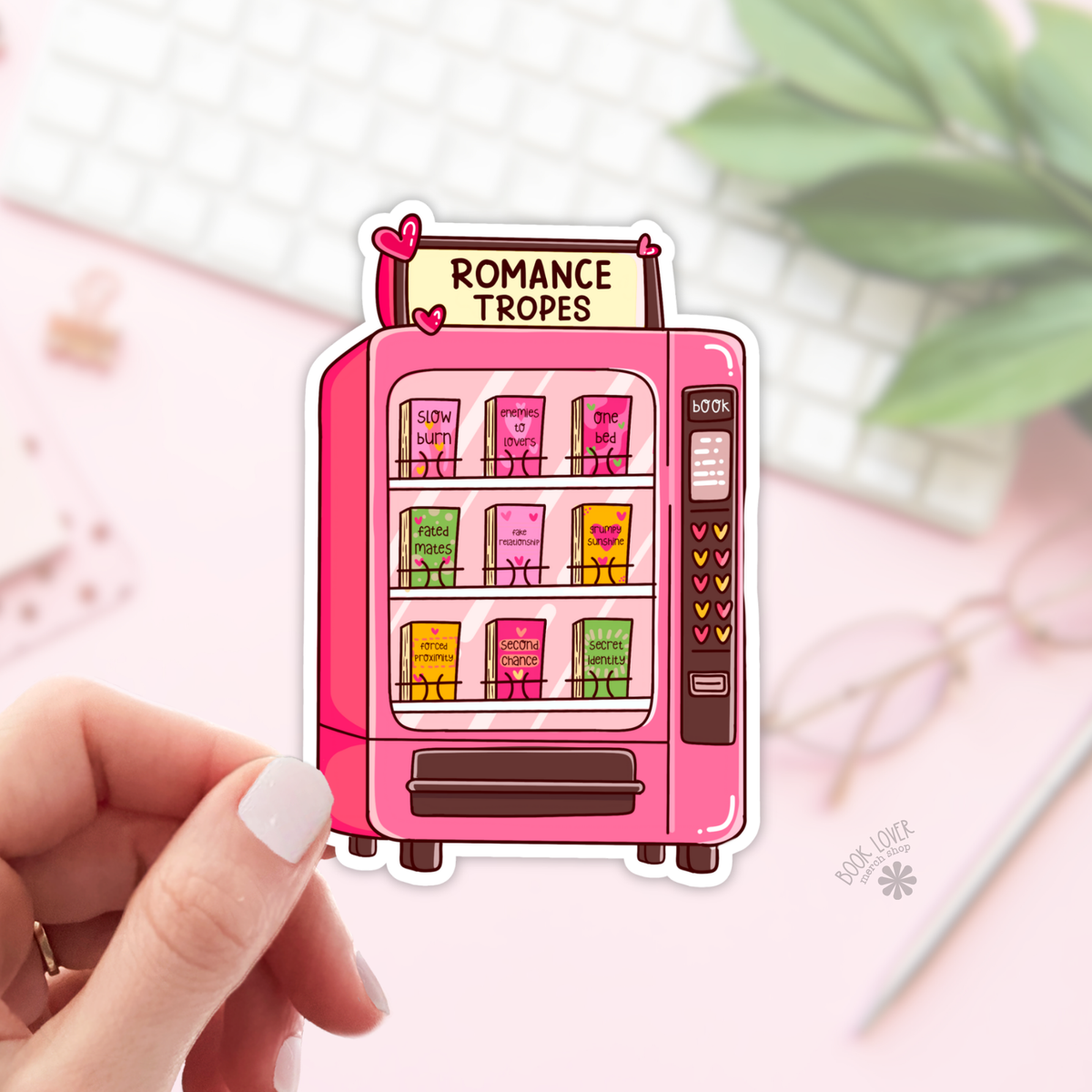 Pink vending machine sticker labeled &