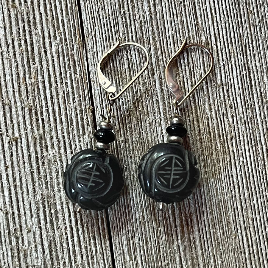 Fortune Stone Earrings featuring carved red jasper and black onyx, symbolizing luck and style.
