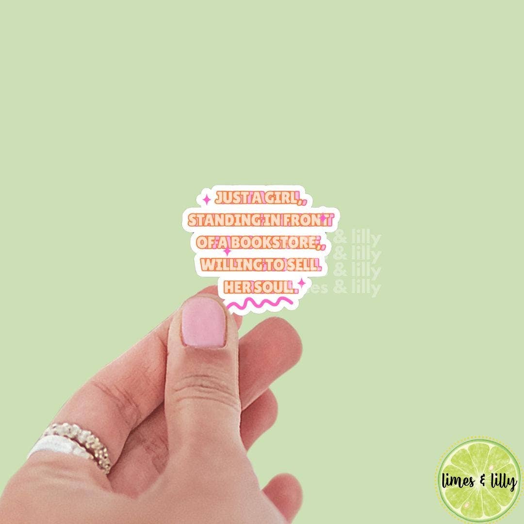 Hand with pink nail polish holding a small card with text on a light green background, featuring the brand &