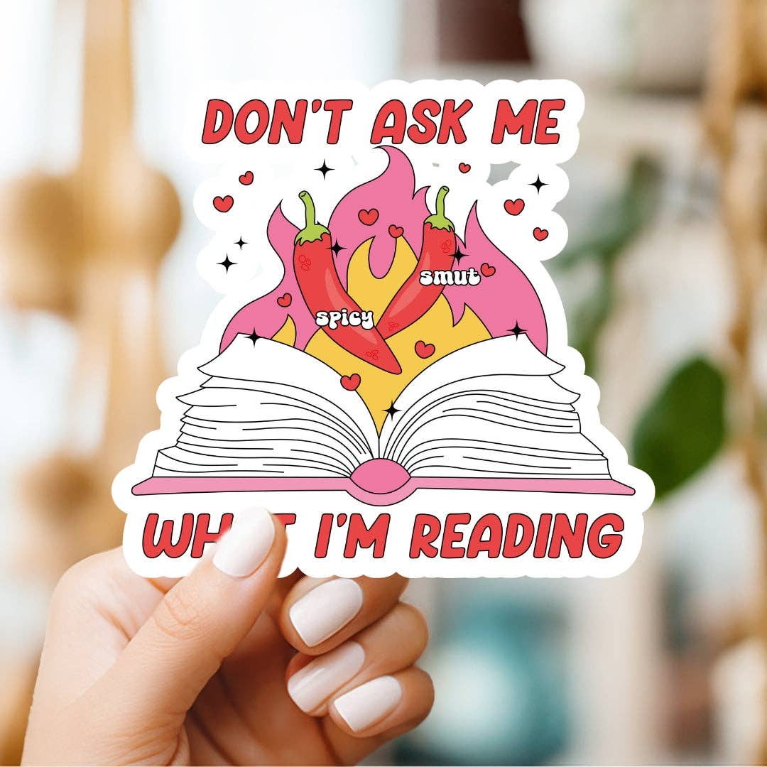 Sticker with an open book and chili peppers, held by a hand, with text &