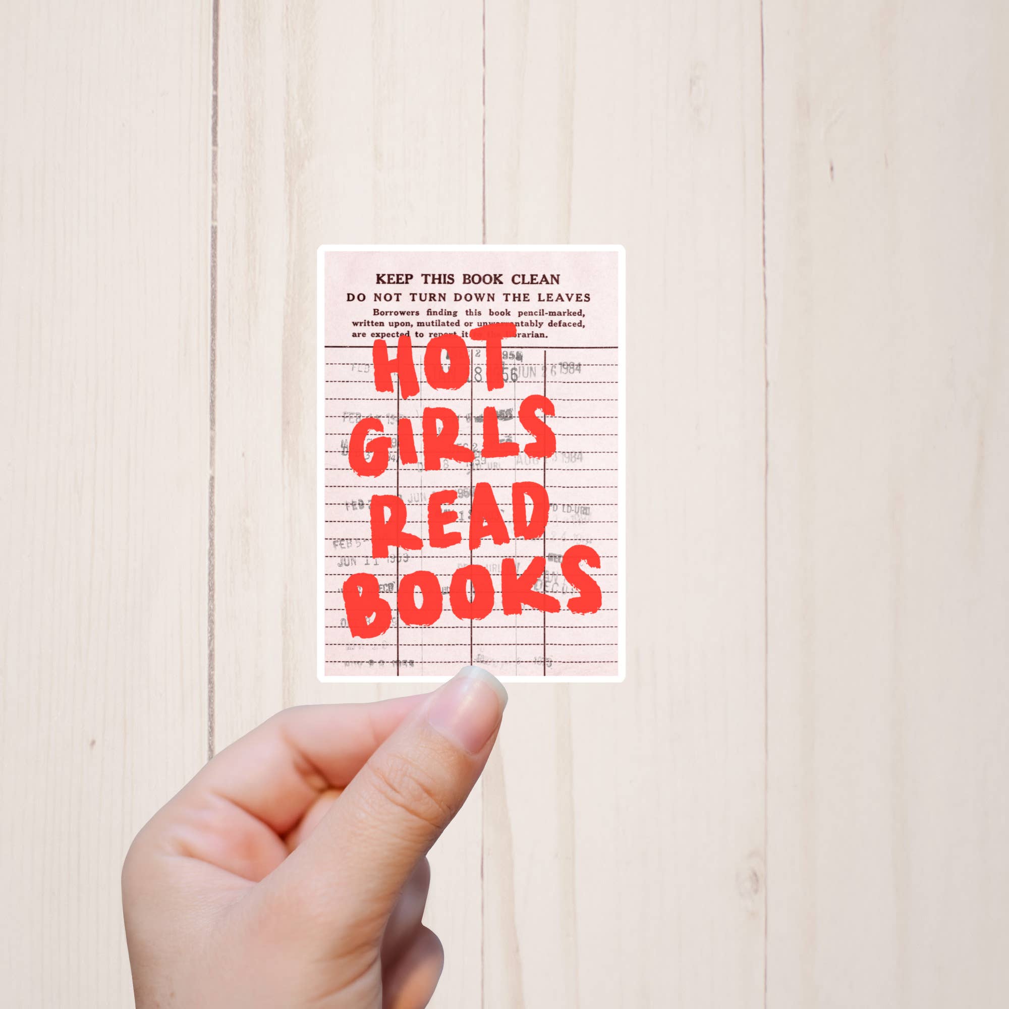 Hand holding a book with &