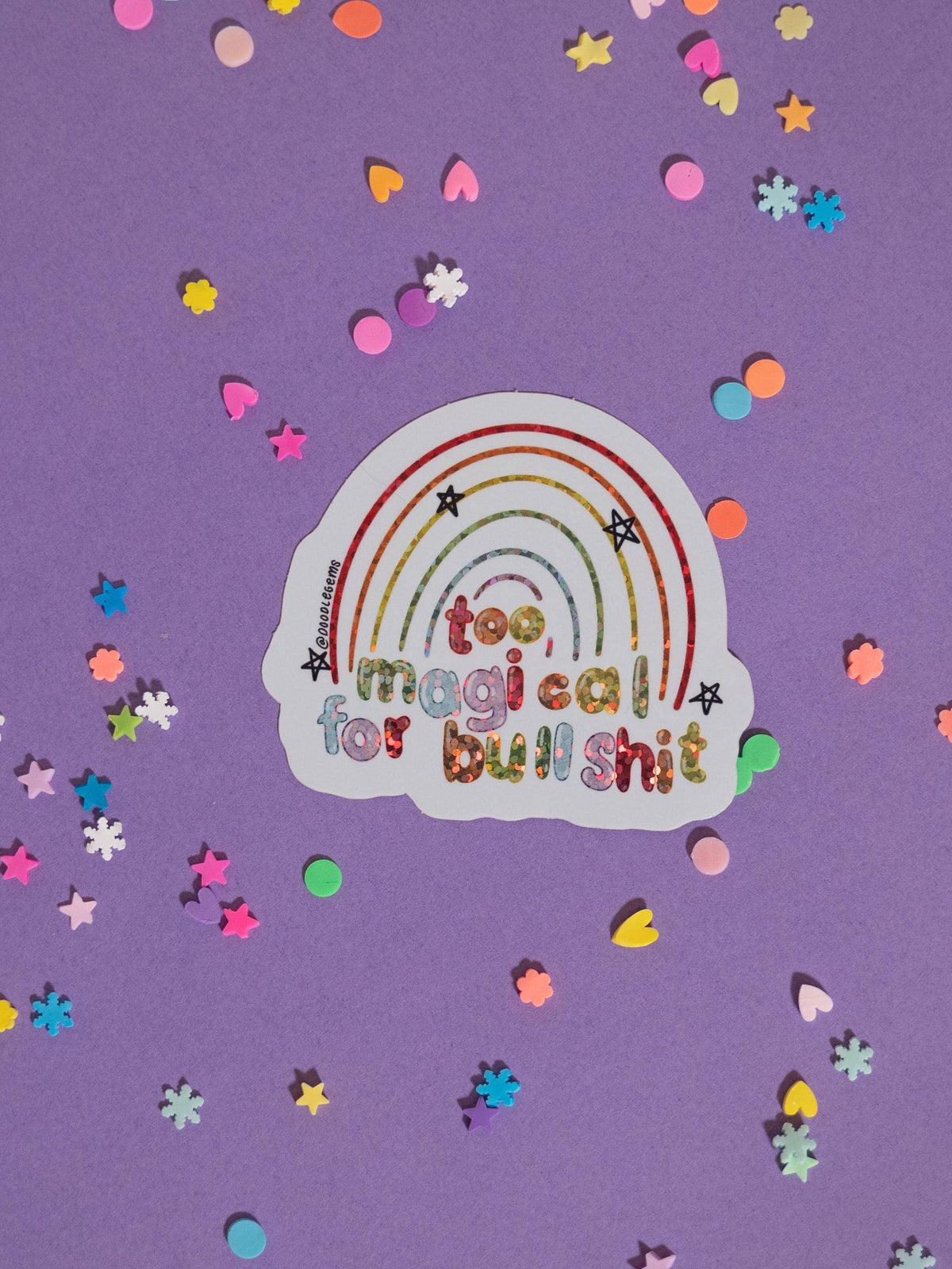 Sticker with rainbow design and text on a purple background with confetti