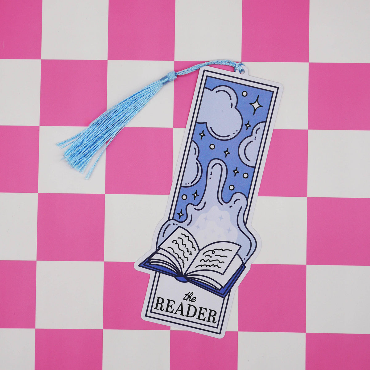 Bookmark with tassel on a pink and white checkered background
