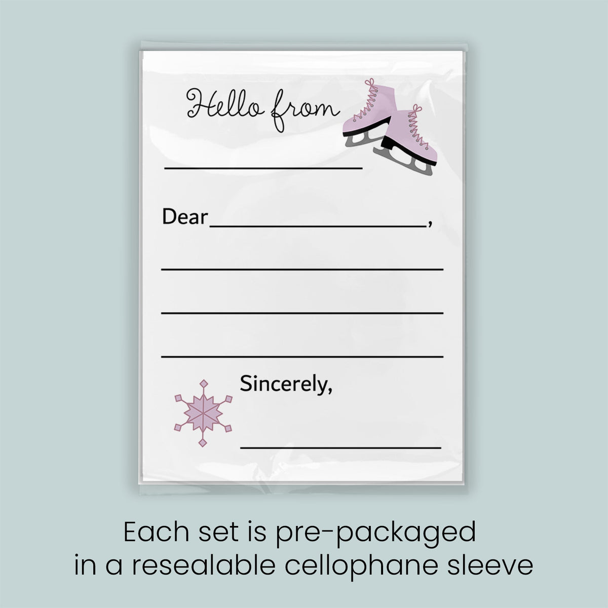 A pre-packaged letterhead set with a snowflake design and a pair of pink skates, indicating that each set is pre-packaged in a resealable cellophane sleeve.