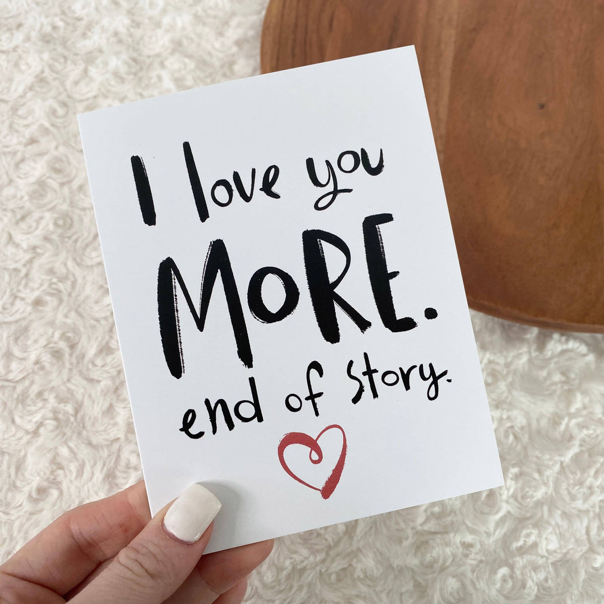 Hand holding a card with &