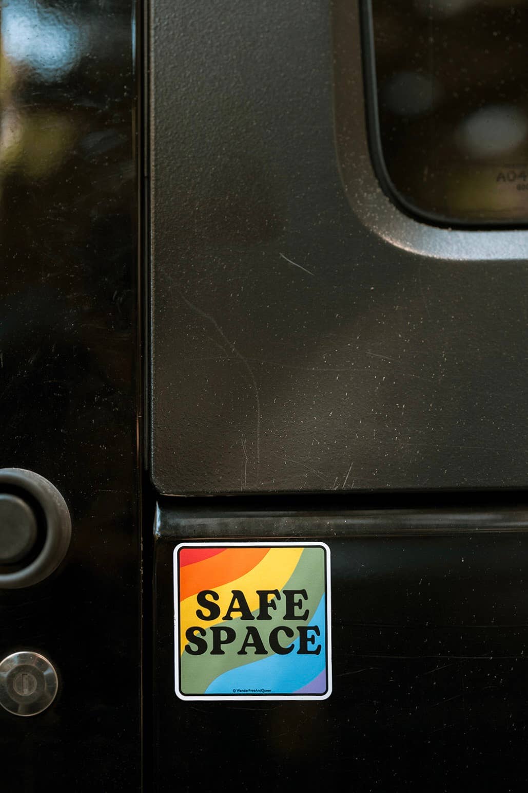 Safe Space sticker on a vehicle door