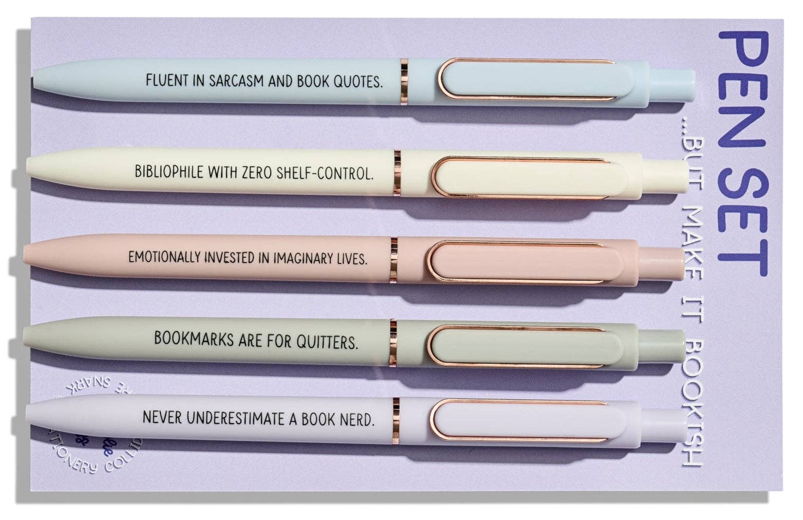 Set of pens with humorous quotes on a purple background