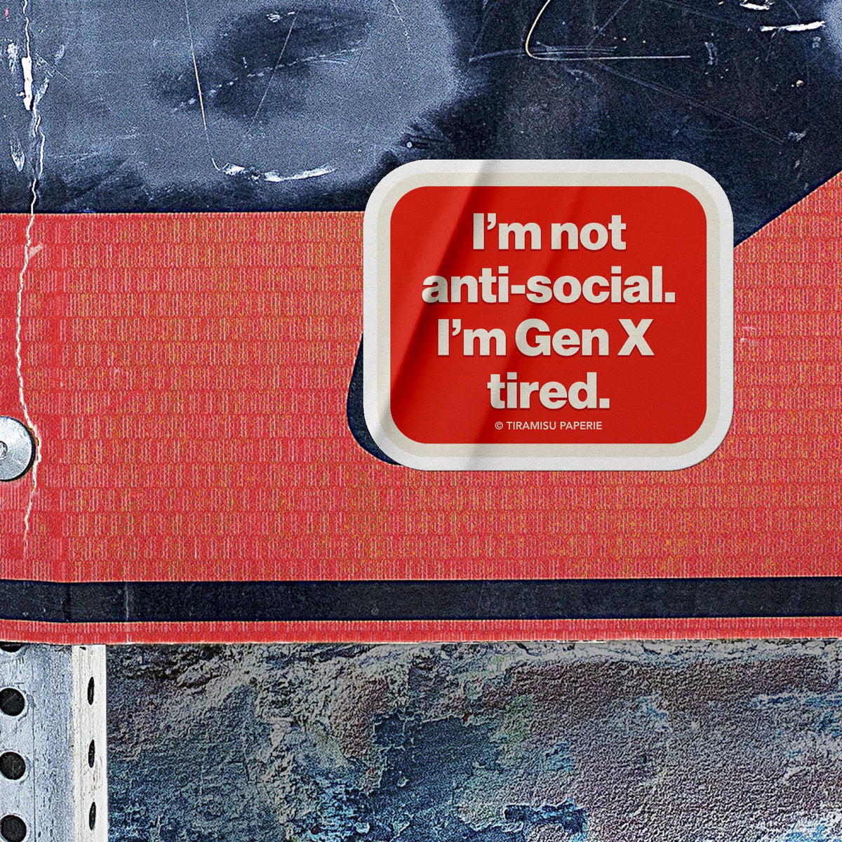 Red notebook with a white label reading &