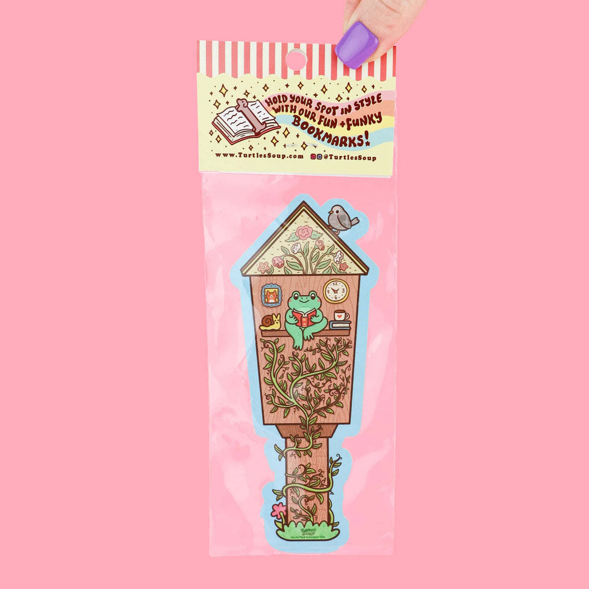 Bookmark with birdhouse design in clear packaging on a pink background