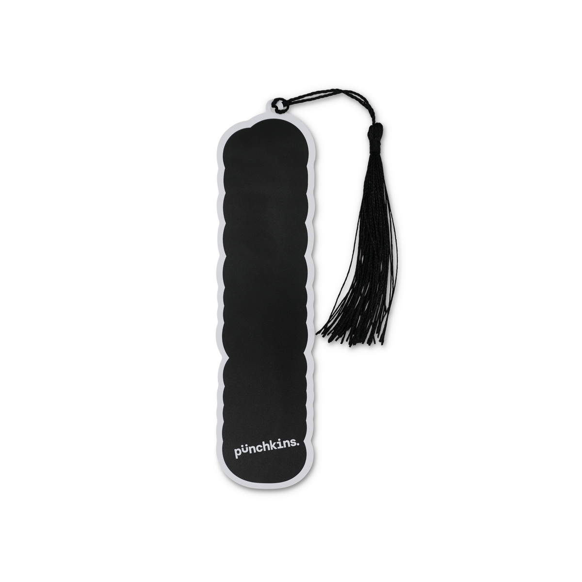 Black and white pincushion with tassel on a white background