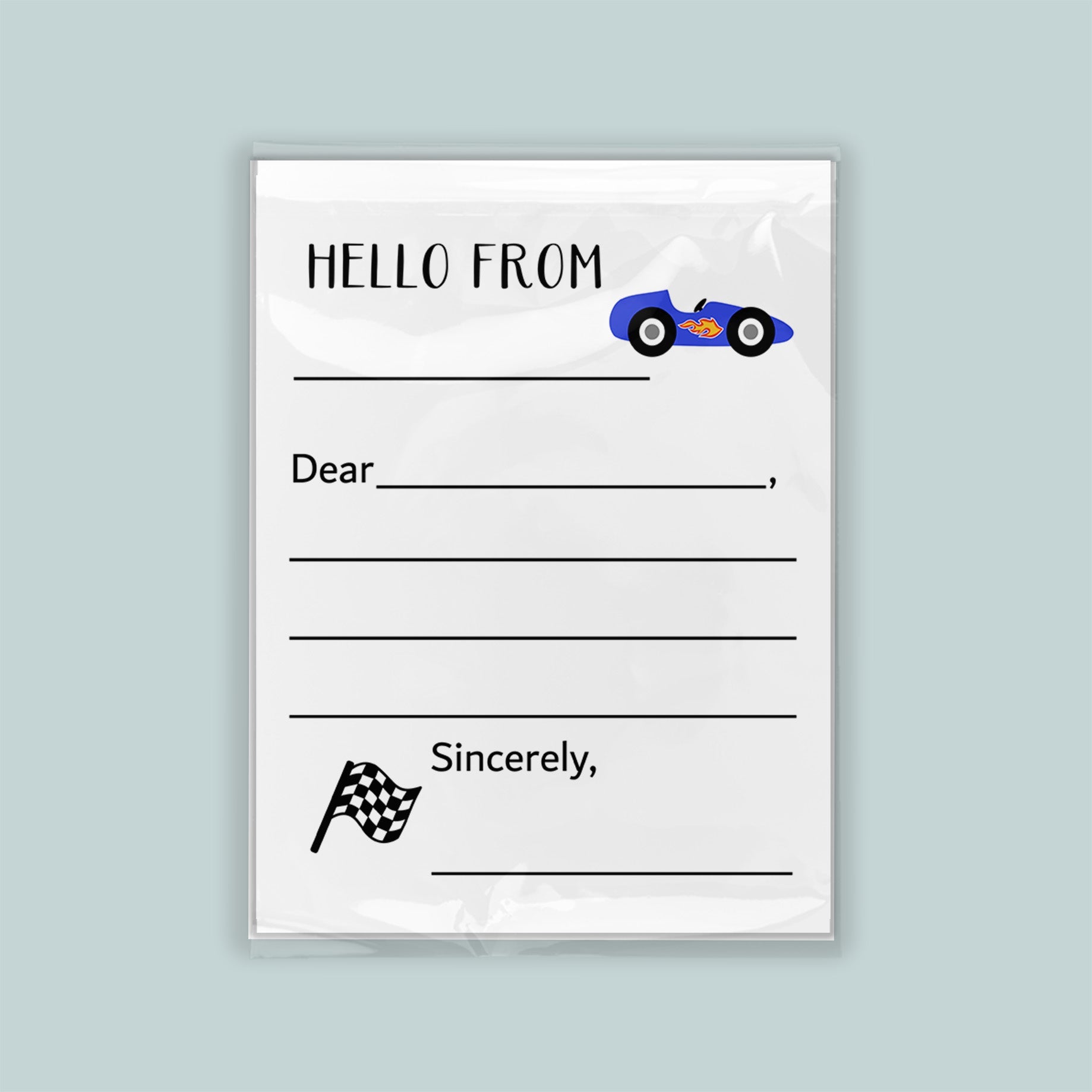 The image is a white envelope with a blue car illustration on the front. The envelope has a blank space for a message and a checkered flag symbol.