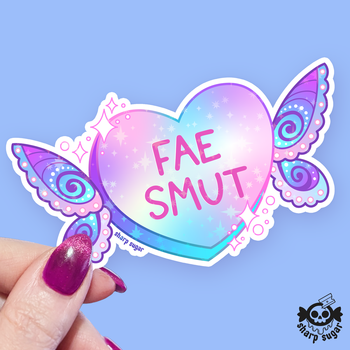A heart-shaped sticker with butterfly wings and the text &