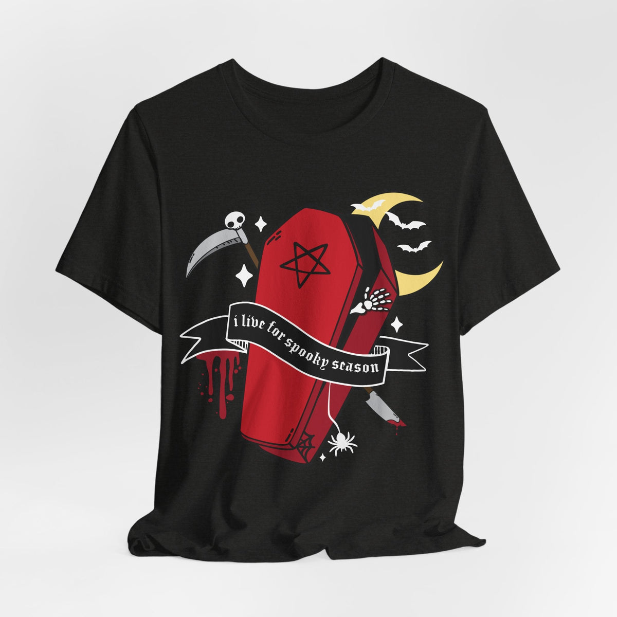 A black short-sleeve t-shirt with a gothic-themed graphic print featuring a red coffin, a scythe, a crescent moon, bats, and a banner that reads &