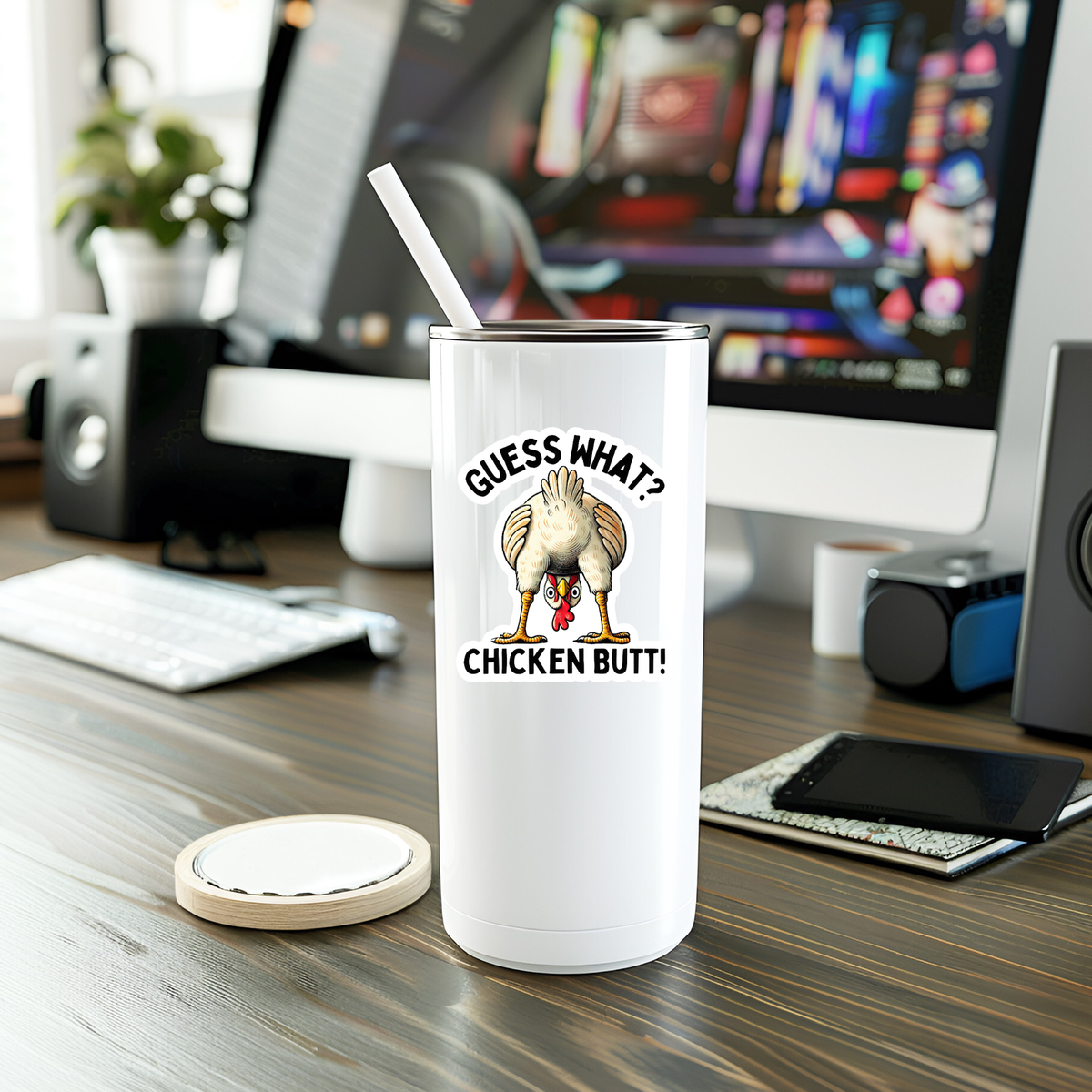 White tumbler with a humorous design on a desk in an office setting