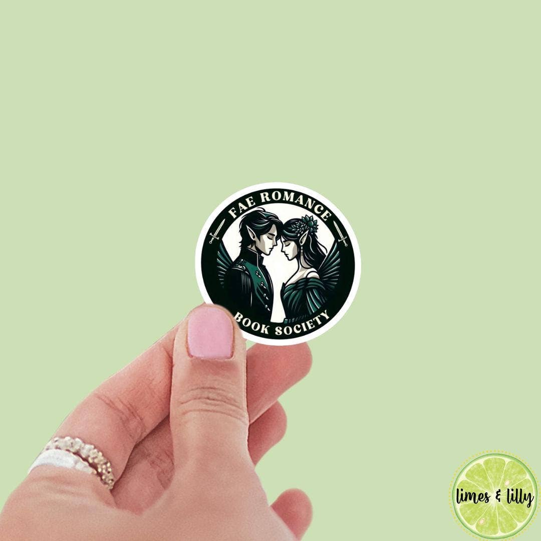 Hand holding a sticker with &