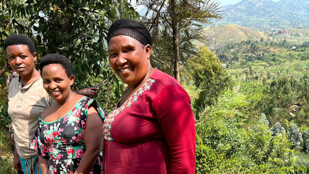 Three women of the Agasake Women standing together with the women&