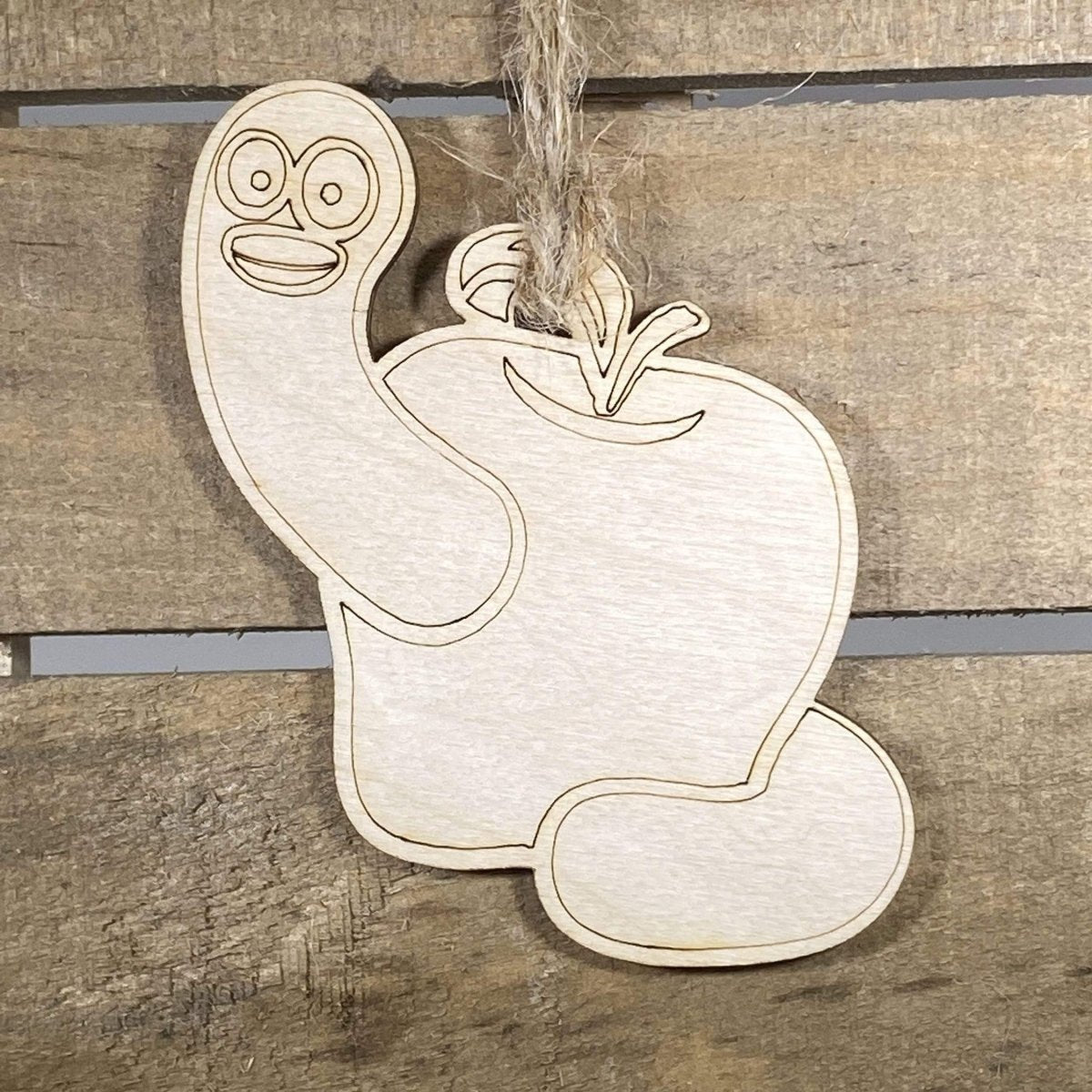 Hand-painted wooden apple and worm Christmas ornament featuring a bright red apple with a playful worm detail, charming holiday decor gift for teachers and classroom appreciation by Cate’s Concepts