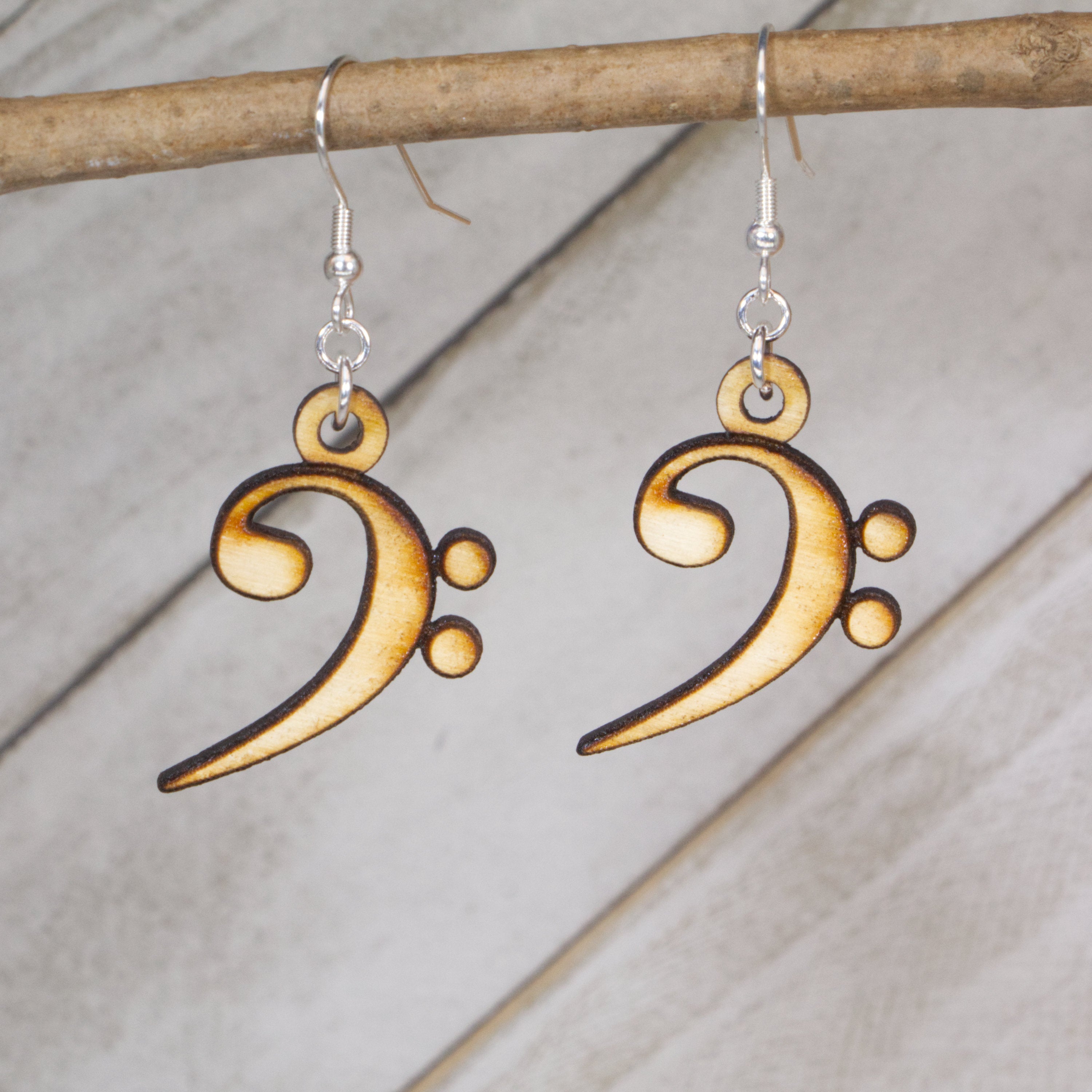 Hand-painted wooden bass clef dangle earrings with bold music note design and hypoallergenic sterling silver hooks, lightweight orchestra jewelry gift for musicians, band students, and music teachers