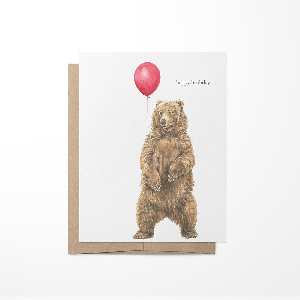 Greeting card with a bear holding a red balloon and &