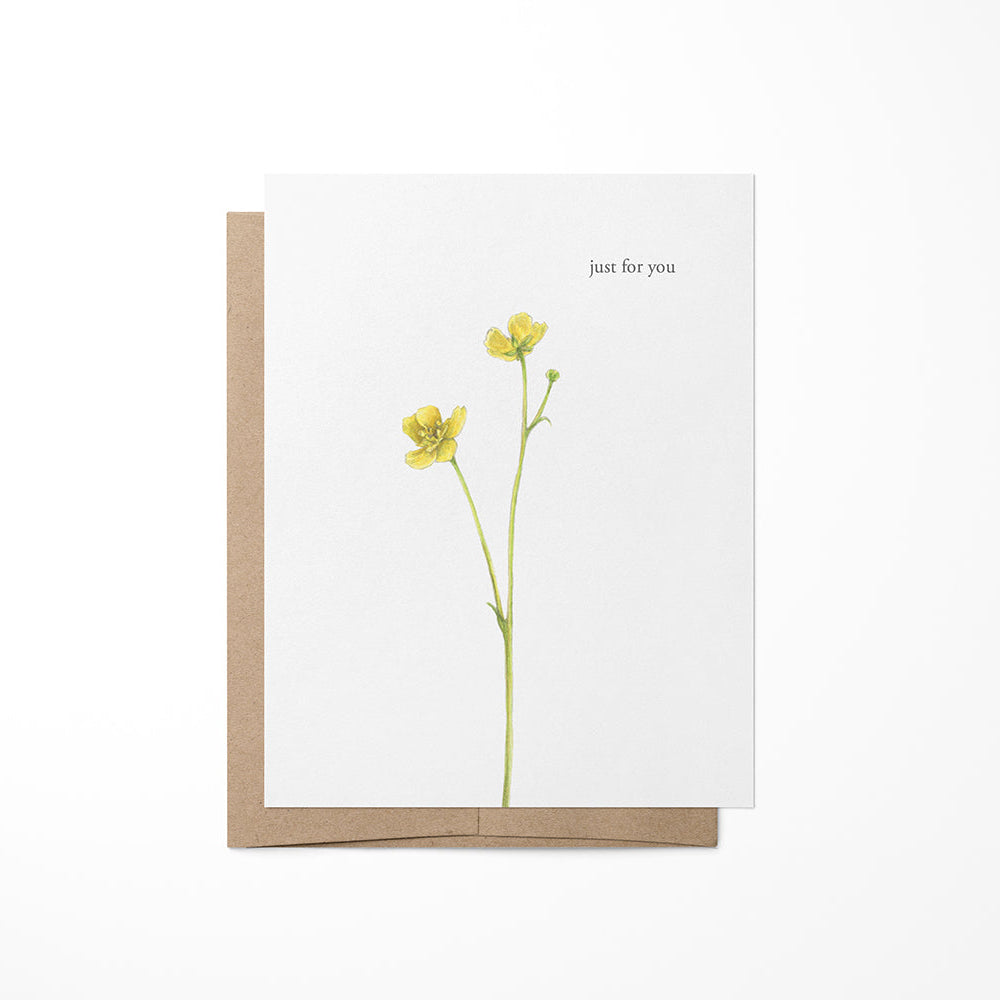Greeting card featuring a watercolor illustration of a buttercup flower