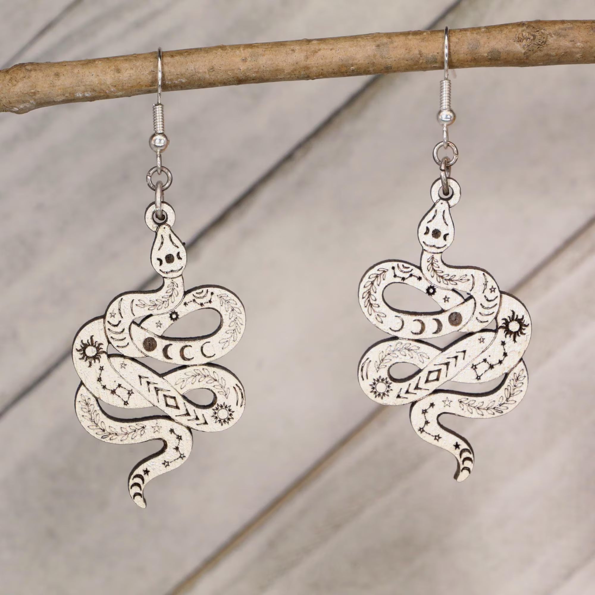 Hand-painted celestial snake wooden dangle earrings with moon phase and mystical design, lightweight hypoallergenic jewelry for boho style, spiritual lovers, and astrology fans