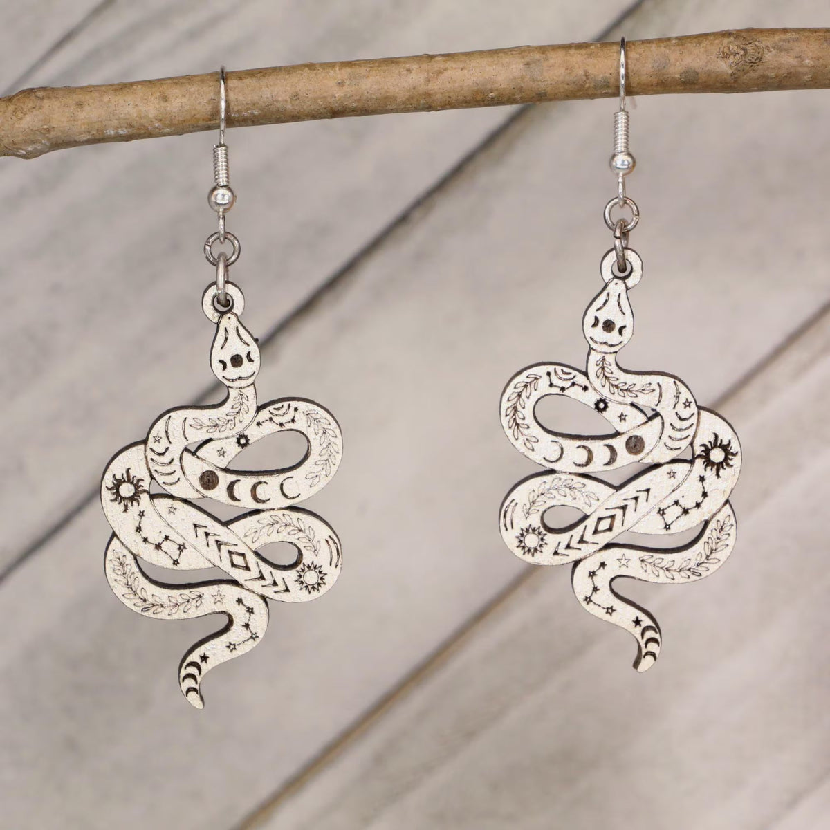 Hand-painted celestial snake wooden dangle earrings with moon phase and mystical design, lightweight hypoallergenic jewelry for boho style, spiritual lovers, and astrology fans